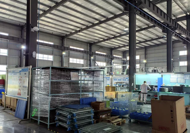 Broadwell factory workshop with workstations, storage racks and industrial production area